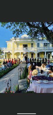 Ceremony in front of the historic Taylor Mansion