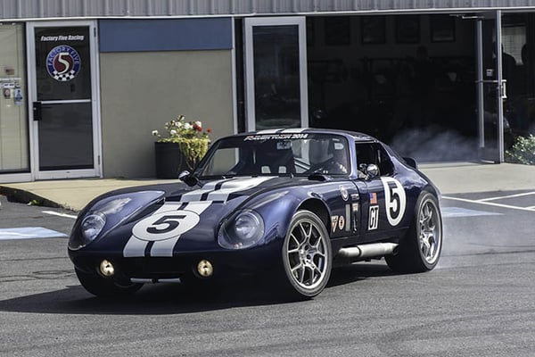 Dave Smith pulls the Coupe out of the showroom for a photo shoot.