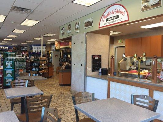 Interior seating.  It's within the NOCO gas station.  Six tables.  Nice and sunny.