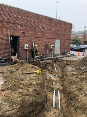 New service pipes being ran to the individual stores in the shopping center