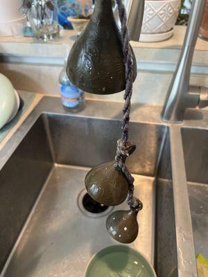 I'm cleaning the bells which hung over their door. Can anyone put me in contact with the owners?