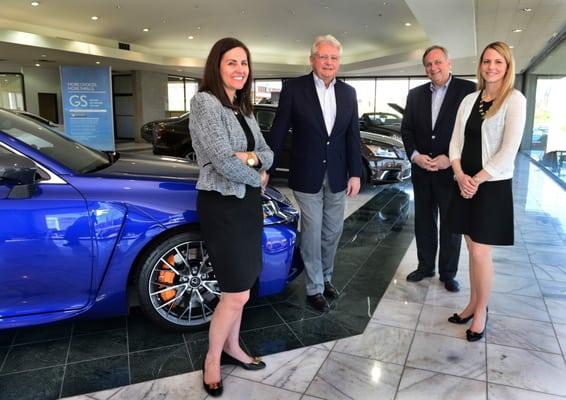 The Moses Auto Group is a father-daughter business, as Bob Moses (second from left) and Steve Moses (second from right) were joined last wee