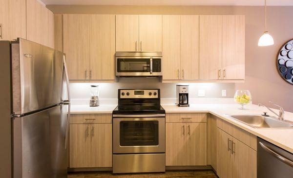 High-end finishes include quartz counter tops and stainless steel appliances.