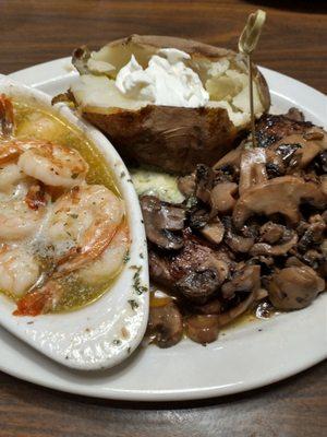 Flat iron steak, shrimp scampi and baked potatoe with butter and sour cream