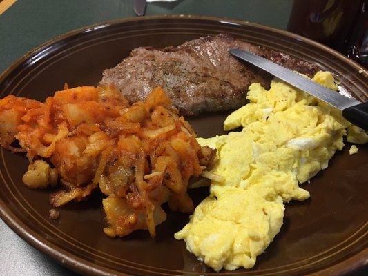 Steak and eggs with spicy home fries. Tender and delicious.