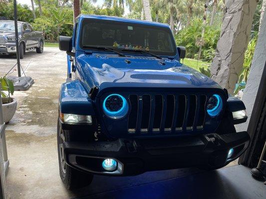 Photograph of Jeep Gladiator after complete install of new lights. Headlights are off, Halo rings are illuminated.