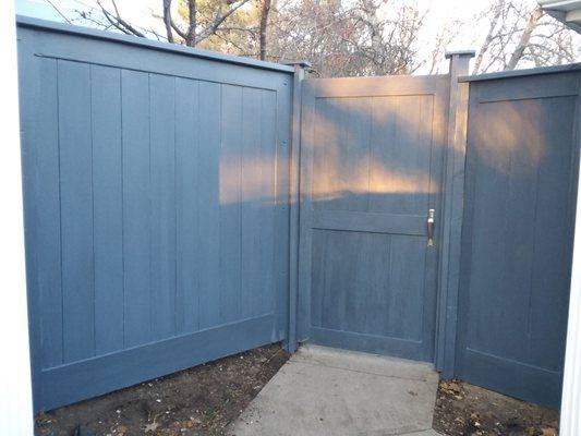 Custom entry fence and gate constructed in panels at the shop.