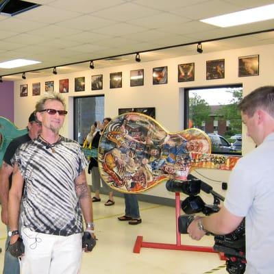 FOX 6 News with local rock n roll artist, Tom Knoll and the 10' Gibson Guitar he painted the the Waukesha Guitar Town project.