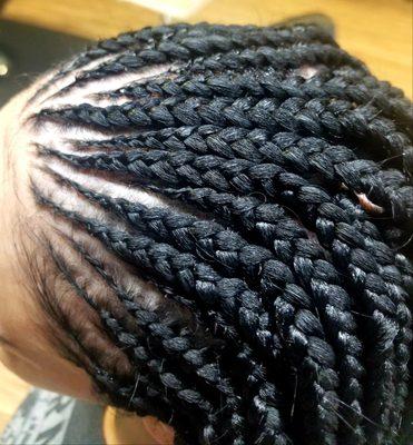 Conrows with box braids in the back