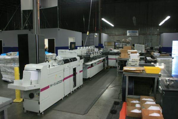 A look at one of Skymail's envelope inserting machines.