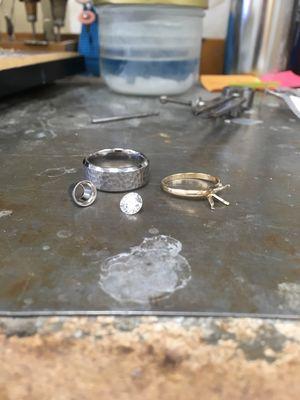 Custom engagement ring in progress. Titanium band with platinum bezel and 1 carat round brilliant diamond.