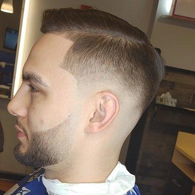 Detailed Haircut & Beard service with a Razor Outline to bring out the Haircut.