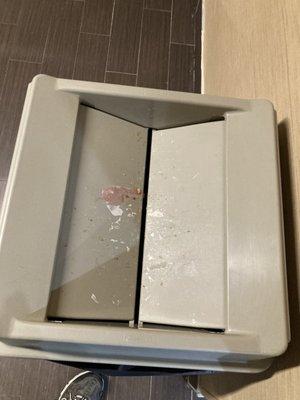 Filthy garbage can in buffet area