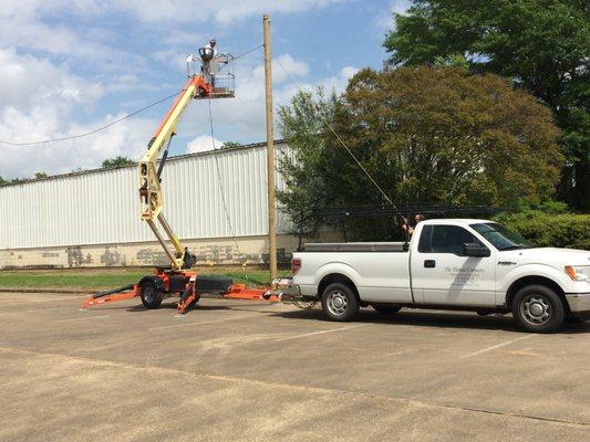 We can repair your parking lot lights.  Give us a call.