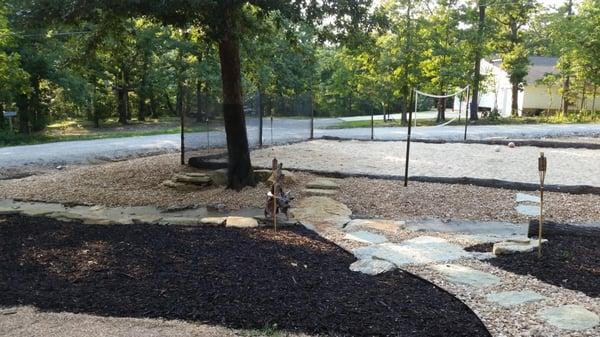 Installation of a sand volleyball court adds to summer fun with family and friends.  Plantings will be added during Phase 2.