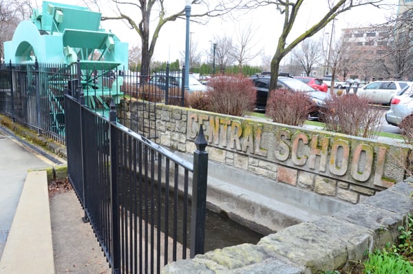 Morris Hill Cemetery waterwheel and Central School name stone.