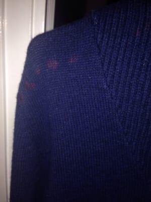 The bleach stains the cleaners refused to admit. They refused to pay for the sweater!