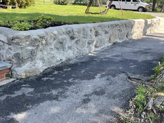 Repointed existing stone wall.