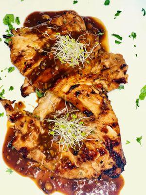 Citrus marinated grilled chicken, pan reduction sauce