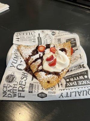 Crepe with chocolate chips and fresh strawberries