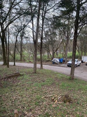 Our view of old picnic tables & debris