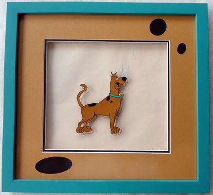 Special custom matting to match Scooby spots. Artwork is original animation cell. 100% conservation package to protect artwork value.