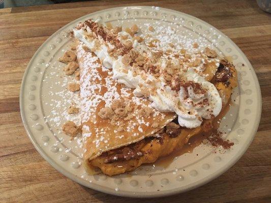 Seasonal pumpkin cheesecake crepe! No bake pumpkin filling, homemade caramel, toasted pecans, graham cracker crust, & cinnamon whipped creme