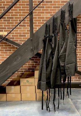 Aprons hanging in the pottery studio