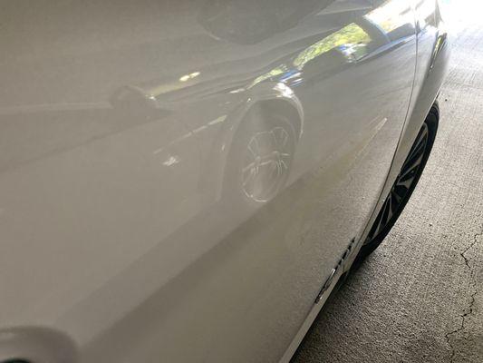 Passenger side door with dent (before repairs).