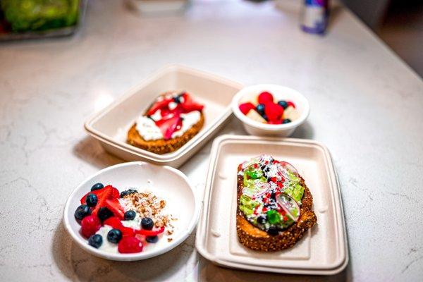 Healthy Breakfast for two, Avo Toast, Whipped Goat Cheese Toast with Jam, Smoothie Bowl and a side of in season fruit.