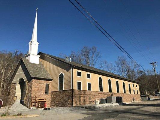 This is a picture of the rebuilt Church. To the right of this building is the fellowship hall/gymnasium/fellowship hall