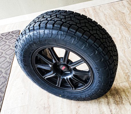 Freshly painted Subaru STI wheels wrapped in some new shoes.  Toyo Open Country AT3 Tires 245/70R17