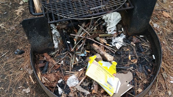 Our fire pit,  not cleaned up for our visit with our 4 - year-old.