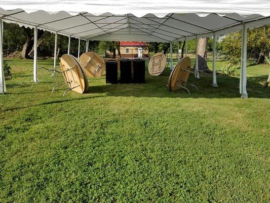 Outdoor Party Event featuring black metal frame chairs, round tables, and 20 x 26 Frame Tent.