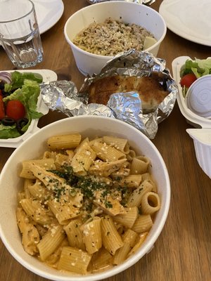 Rigatoni chicken and peas (front), spaghetti with white clam sauce (back)