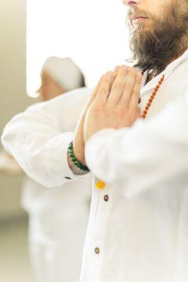 kundalini yoga and meditation student in Prayer Pose