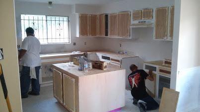 sand down and repaint kitchen cabinets, add granite counter tops.