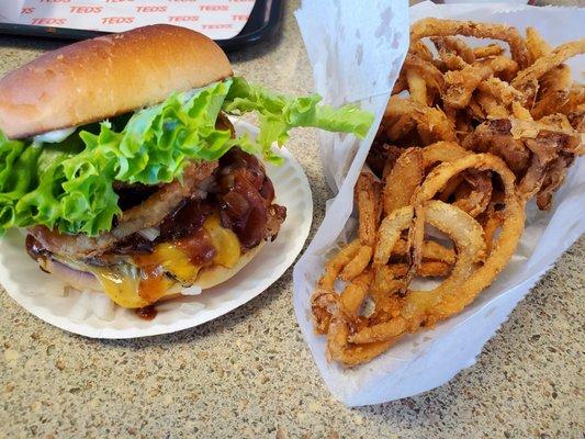 Double cheeseburger with bacon, onion, lettuce, tomato, onion rings, BBQ, Mayo and a side of onion rings