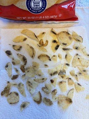 Black spots on chips! You need to have the lady who took out the bad chips before they got bagged come back to work!