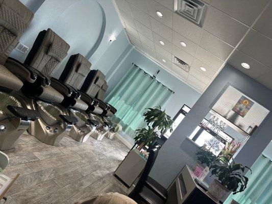 Pedicure massage chairs in an elegant setting.