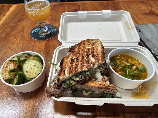 Birria panini-pressed sandwich.