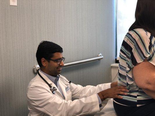 Dr. Tripathi examining a patient