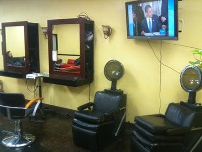 Chairs to dry hair at His n' Hers Cuts located in Downey, California.