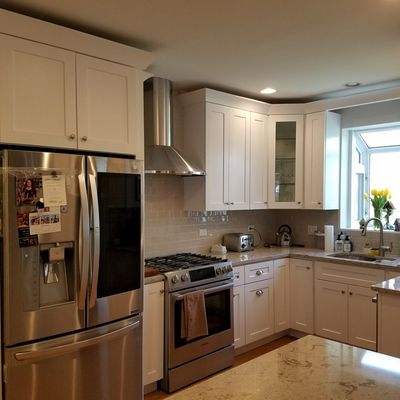 All wood White Shaker cabinets with Cambria coutertops