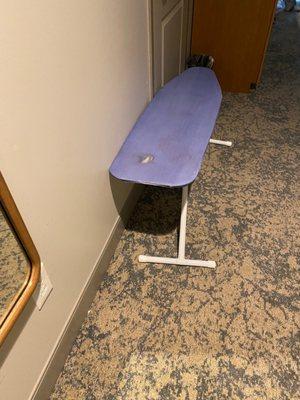 Broken ironing board and that's as high as it would go. I asked the front desk for another one, but it never came.