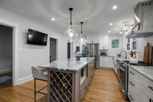 Kitchen remodeling. Large island. White shaker cabinets. White subway tile backsplash. Countertop installation. Philadelphia, PA.