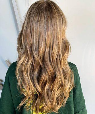 Classic honey blonde balayage by Callie. We love the look of these natural highlights done at our West Dundee salon!