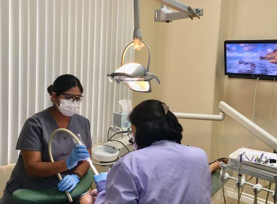 Dr.Kim and Iris working on patient