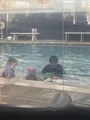 Toddler swim class two students two instructors