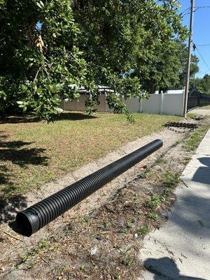 Installing culvert pipes.